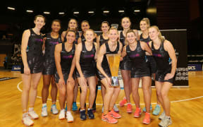 The Silver Ferns with the Taini Jamison Trophy after their series win over England