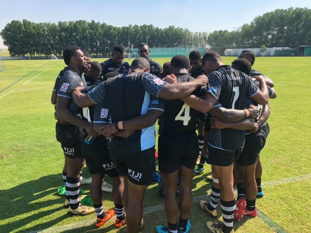 The Fiji sevens team huddle together during a training session in Dubai.