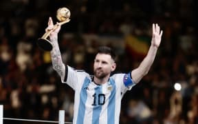 LUSAIL CITY, QATAR - DECEMBER 18: Lionel Messi of Argentina poses for a photo with the adidas Golden Ball award during the FIFA World Cup Qatar 2022 Final match between Argentina and France at Lusail Stadium on December 18, 2022 in Lusail City, Qatar. Mohammed Dabbous / Anadolu Agency (Photo by Mohammed Dabbous / ANADOLU AGENCY / Anadolu Agency via AFP)
