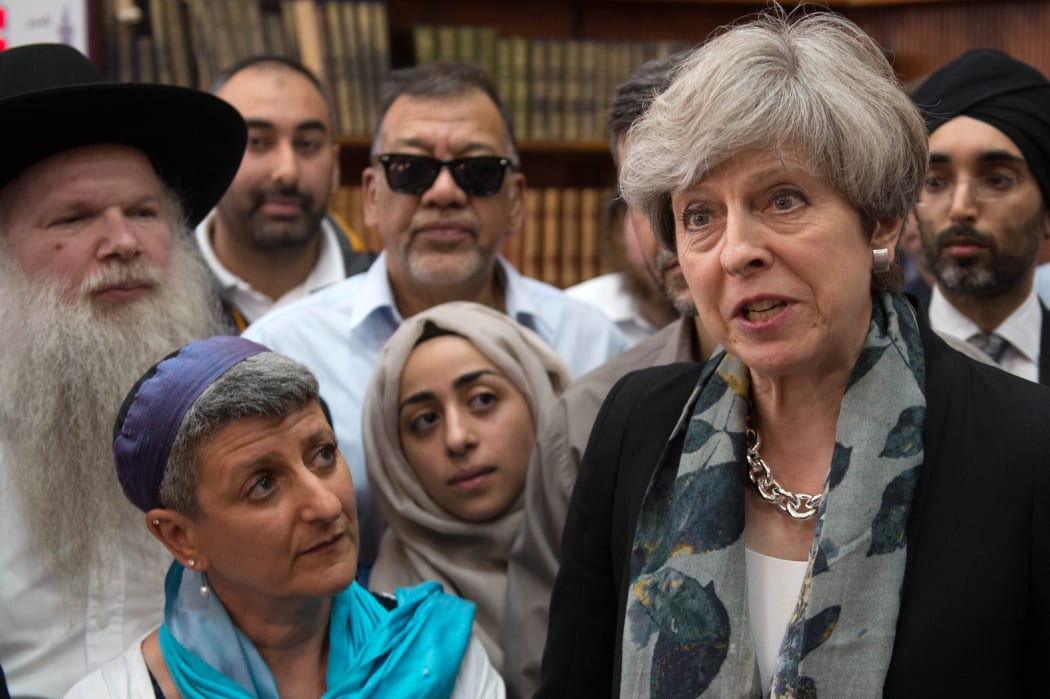 Prime Minister Theresa May talks to faith leaders at Finsbury Park Mosque in north London.