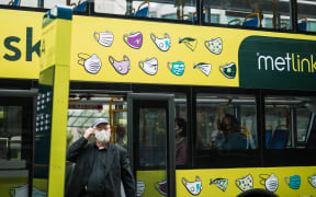 A bus passenger wears a mask during level 2 in Wellington, 15 February 20201.