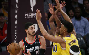 Portland Trail Blazers' Enes Kanter  looks to pass during an NBA basketball game between Los Angeles Lakers.