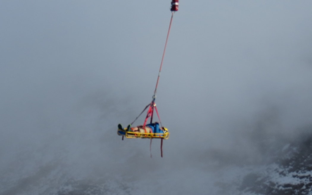 A German backpacker is lifted off Mt Tongariro.
