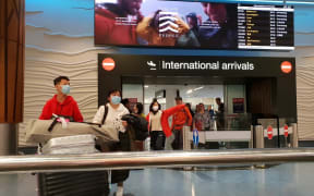 Passengers from international flights at Auckland Airport on Monday 27 January, after flights from Guangzhou and Shanghai had touched down.