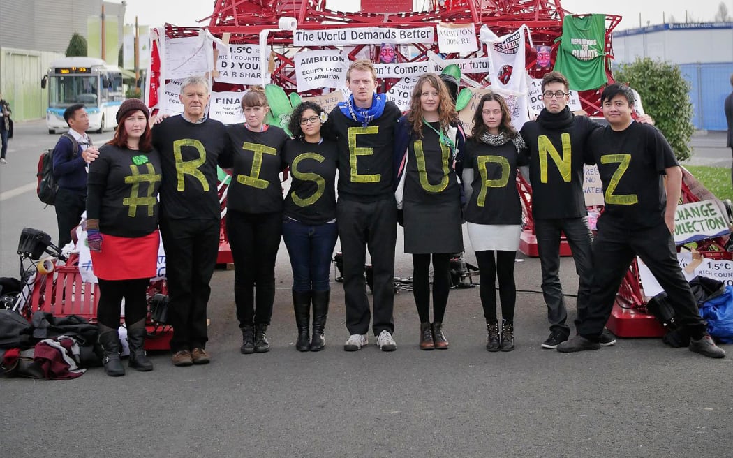New Zealand youth delegates protest as part of the Rise Up campaign at COP21 in Paris.