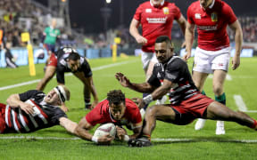 Anthony Watson scores the Lions' first try.