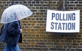 Britons go to the polls on a rainy June day to vote on whether Britain should stay in or leave the EU.