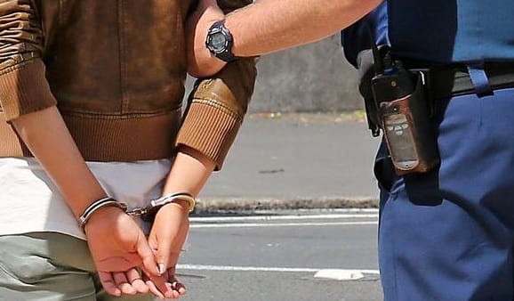 generic arrest person in handcuffs