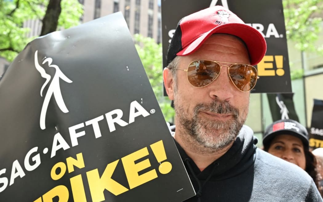 Jason Sudeikis joins members of the Writers Guild of America and the Screen Actors Guild at a picket line outside NBC Universal in New York City.