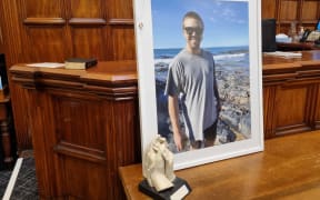 At a coroner's inquest into the death of Rory Nairn, his partner Ashleigh Wilson placed a photo of him at the front, along with his wedding ring and a cast of their hands together.