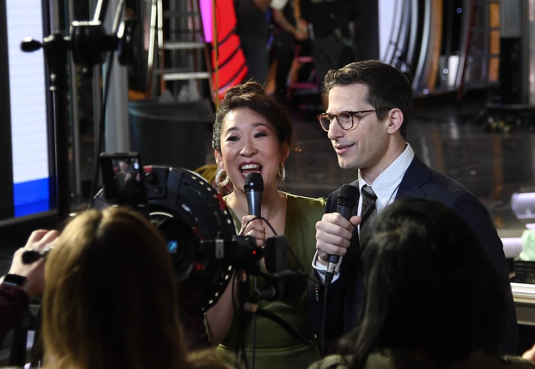 Sandra Oh and Andy Samberg, hosts of the 76th Annual Golden Globe Awards, are interviewed by the media in front of the main stage during a preview day at The Beverly Hilton Hotel on January 3, 2019 in Beverly Hills, California.