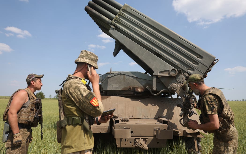 Ukrainian gunners prepare to fire a BM-21 Grad multiple rocket launcher near Izyum, south of Kharkiv, on June 11, 2022 amid the Russian invasion of Ukraine.