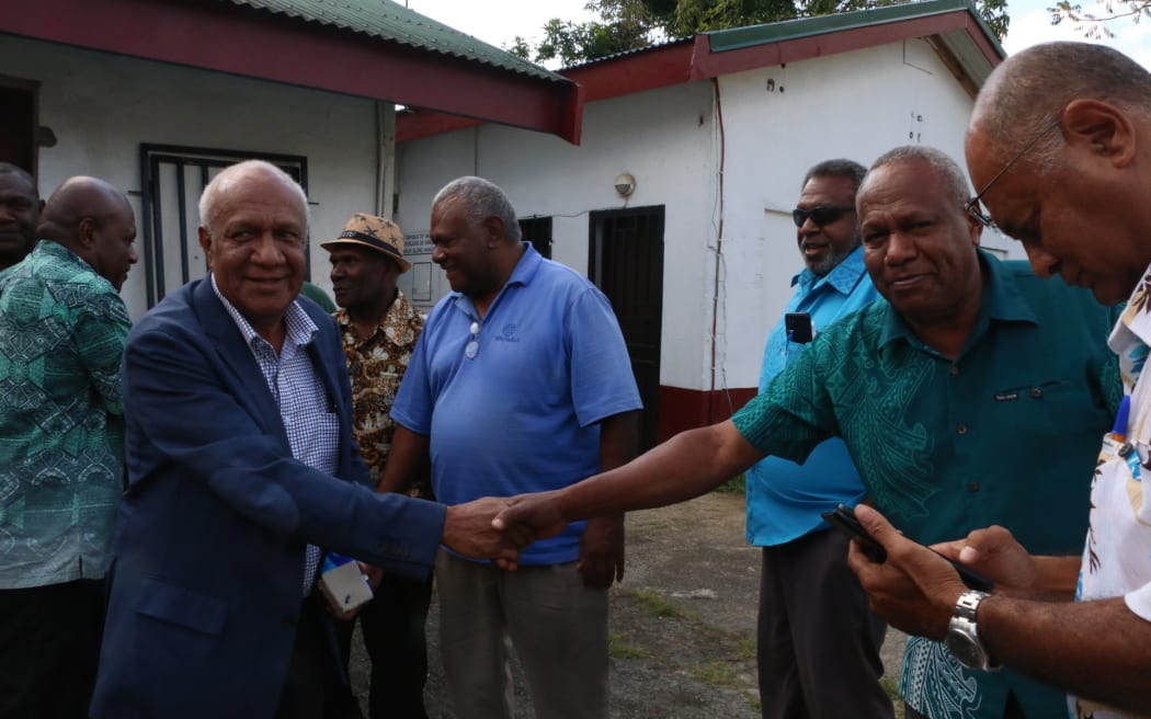 Sato Kilman with opposition supporters outside the Vanuatu Supreme Court in Port Vila. 25 August 2023 Photo: RNZ Pacific / Kelvin Anthony