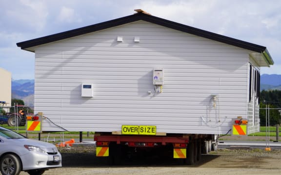 A Toitū home on the truck, ready for delivery