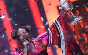 Israel's singer Netta Barzilai aka Netta performs with the trophy after winning the final of the 63rd edition of the Eurovision Song Contest 2018.