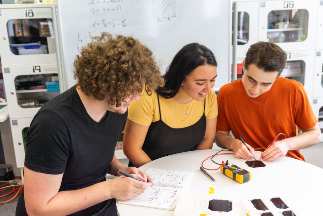 Astrix co-founders Max Daniels, Fia Jones and Willam Hunter (far right), testing space qualified space cells.