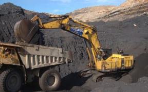 Digger loads up a truck at Stockton Coal Mine.