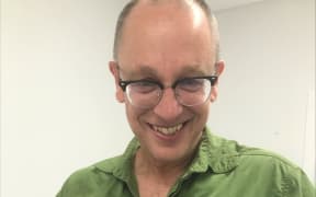 Professor Brett Gartrell from Wildbase, School of Veterinary Science at Massey University holds a Kiwi in his arms