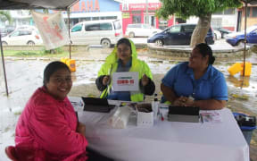 Health workers offering Covid-19 vaccinations in Tonga.
