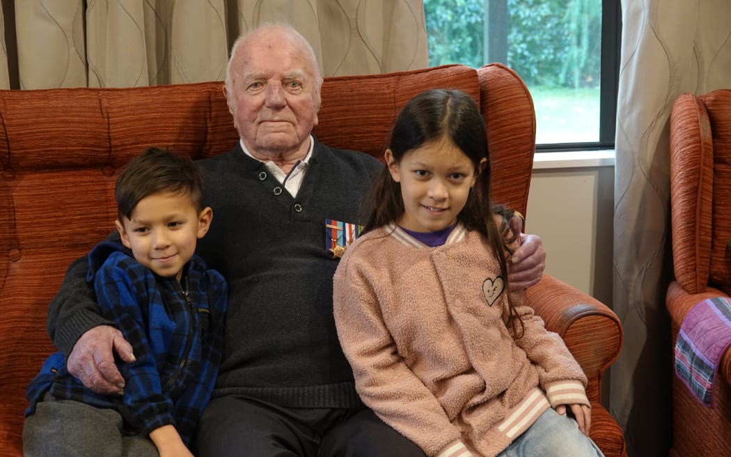 Eddie Chapman sits with great-grandchildren Jayden Him, 6, and Riharna Him, 8, from Paraparaumu.