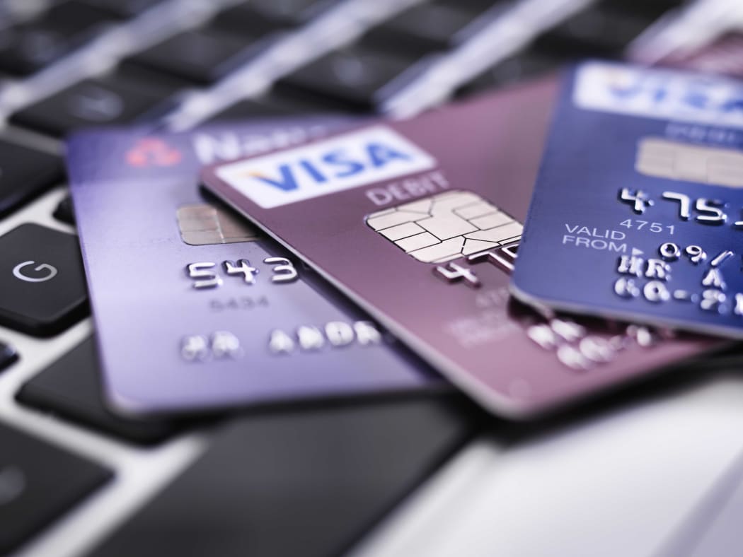 Credit card on laptop illustrating online shopping and banking.