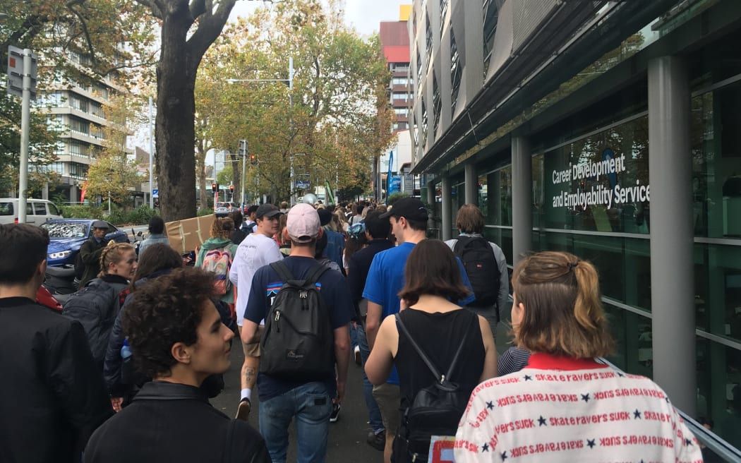 University of Auckland students march to protest the potential closure of specialist libraries.