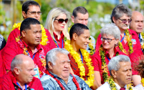 The Samoan prime minister Tuilaepa Sailele Malielegaoi is photographed with conference delegates in red.