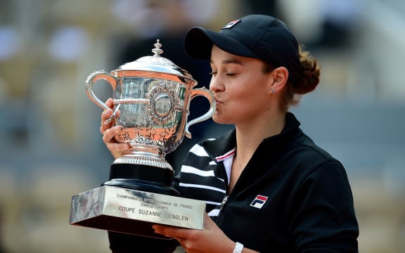 Ashley Barty celebrates with French Open trophy.