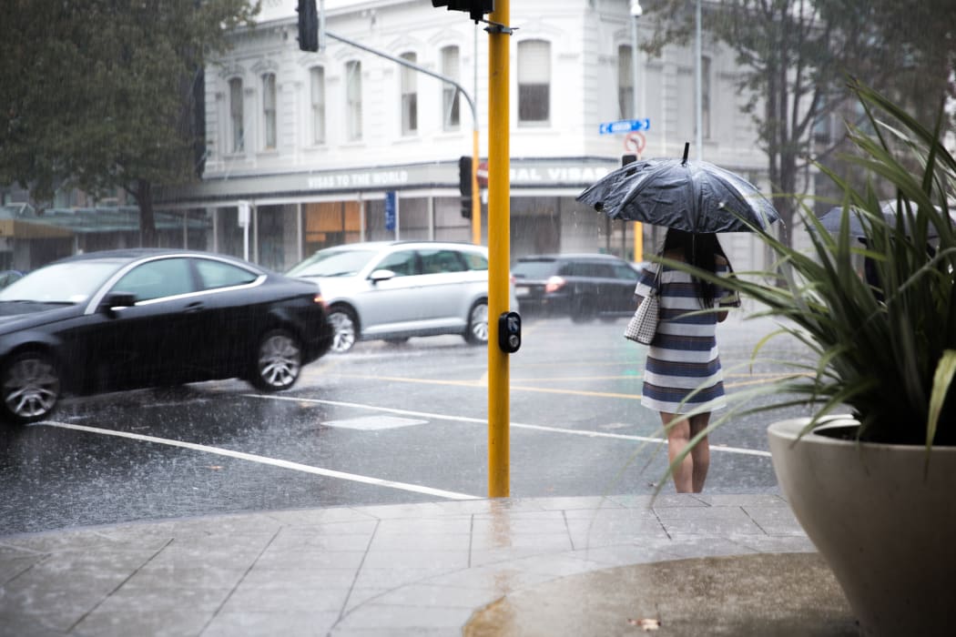 Rain pours down in the Auckland CBD.