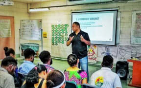 Scott Waide speaks at a Transparency International PNG youth programme.