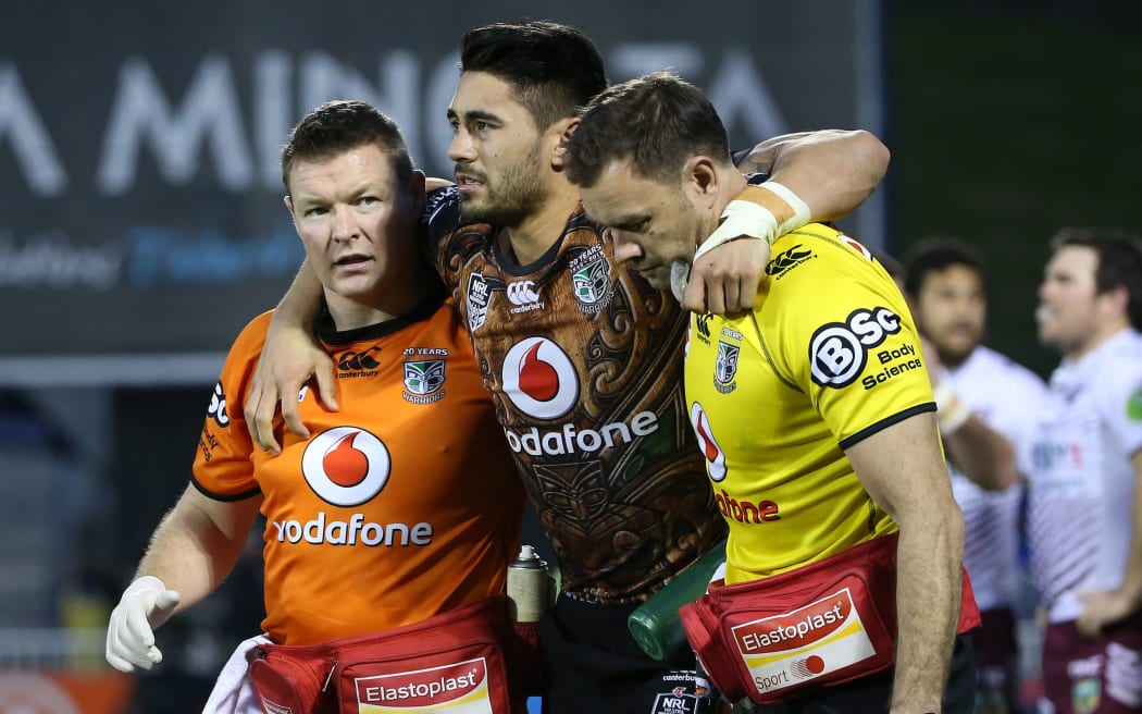 Warriors player Shaun Johnson is injured as he scores a try in the NRL Rugby League, Warriors v Sea Eagles at Mt Smart Stadium, Auckland, New Zealand. 25 July 2015. Copyright Photo: Fiona Goodall / www.photosport.nz