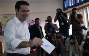 Greek Prime Minister Alexis Tsipras votes in the referendum.