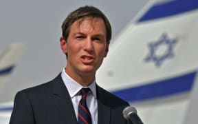 US Presidential Adviser Jared Kushner speaks in front of an air-plane of El Al at the Abu Dhabi airport, following the arrival of the the first-ever commercial flight from Israel to the UAE, on August 31, 2020.
