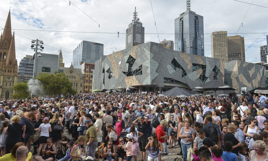 People pay their respects to the Bourke Street victims at Federation Square in Melbourne last Monday.