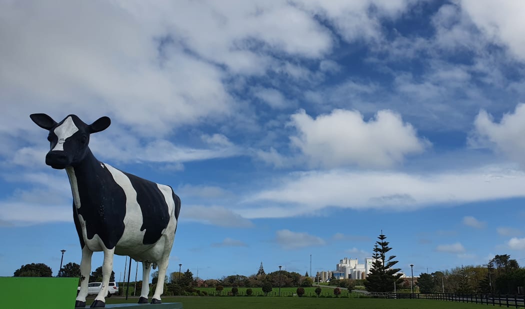 Fonterra's Whareroa plant behind a symbolic dairy cow near Hawera
