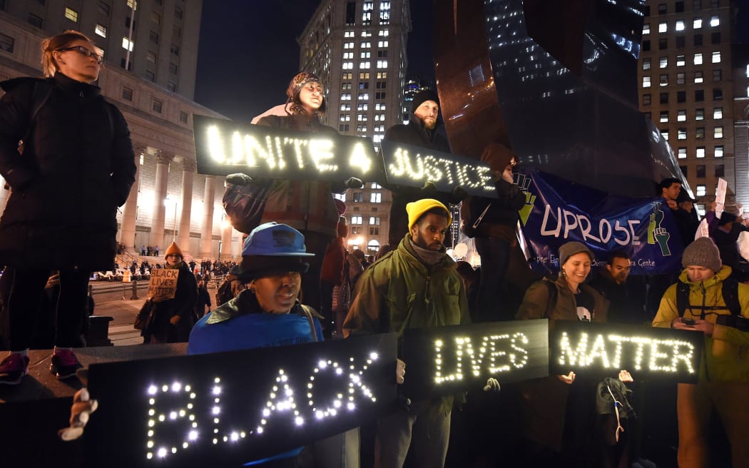 Protesters stand in Foley Square in New York City during demonstration against the chokehold death of Eric Garner.
