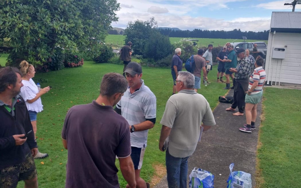 Members of the roughly 80-strong Dartmoor community northwest of Napier, which has been completely cut off following Cyclone Gabrielle, with roads at either end out of the town blocked by slips.