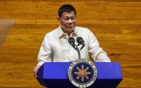 (Philippine President Rodrigo Duterte speaks during the annual state of the nation address at the House of Representatives in Manila on July 26, 2021.