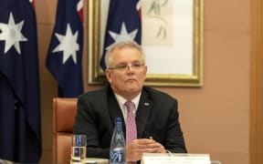 Australian Prime Minister Scott Morrison attends a video conference with G20 leaders to discuss the COVID-19 coronavirus, at the Parliament House in Canberra on March 26, 2020.