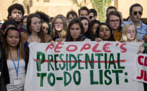 American students protest outside the UN climate talks during the COP22 international climate conference in Marrakesh in reaction to Donald Trump's victory in the US presidential election.