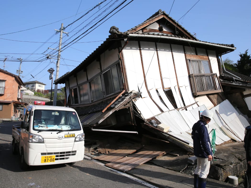 A house collapses as the aftershock continues in Mashikii, Kumamoto Prefecture, western Japan on April 15, 2016. A powerful earthquake with an estimated magnitude of 6.4 struck the Kyushu region on Thursday night,