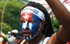 Papuan student takes part in a rally in Surabaya, East Java.