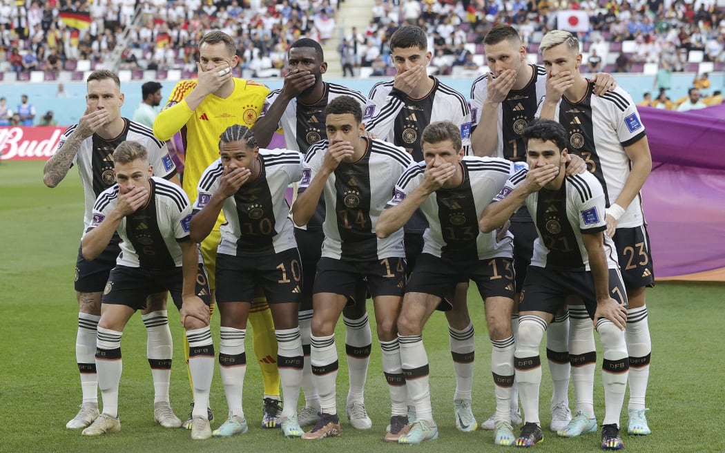 Germany players cover their mouths. Protest versus the ban on wearing the One Love captain's armband. World Cup 2022.