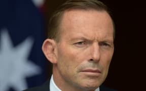 Prime Minister Tony Abbott attended a candlelight vigil in Canberra for two Australian's on death row.