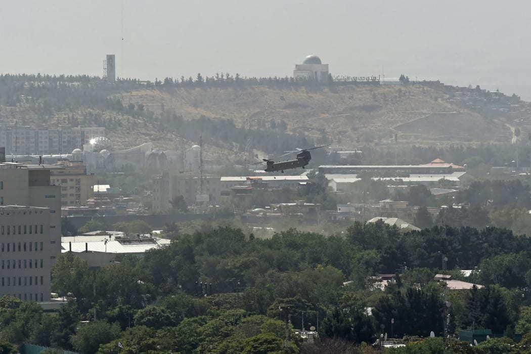 A US military helicopter is pictured flying above the US embassy in Kabul on August 15.