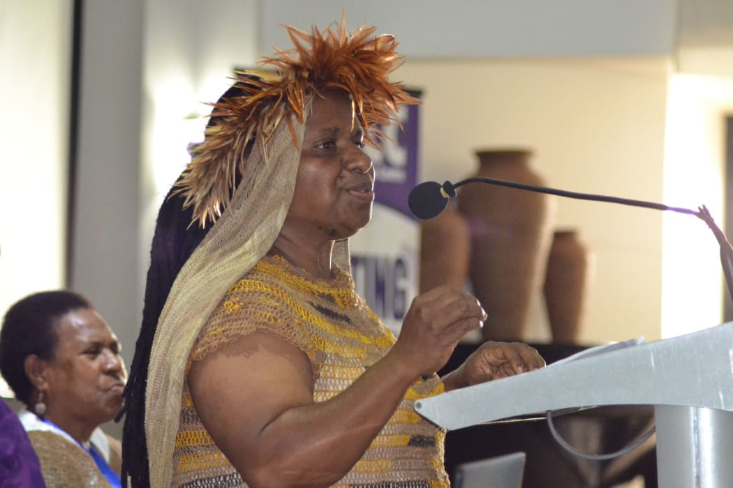West Papuan human rights activist Rode Wanimbo address the 7th Pacific Women's Network Against Violence Against Women, while Bernadetha Mahuse looks on.