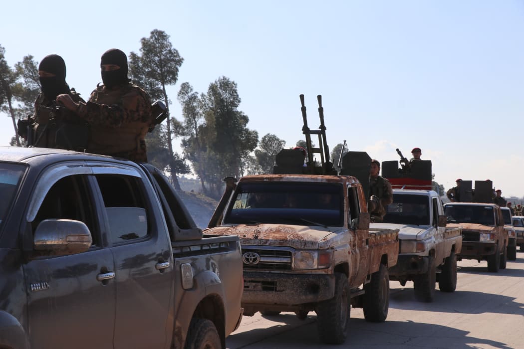 Hamza Division, a member of the Turkey-backed Free Syria Army (FSA), dispatch fighters and armored vehicles to the Manbij border line in Syria's Al-Bab town on December 28, 2018.