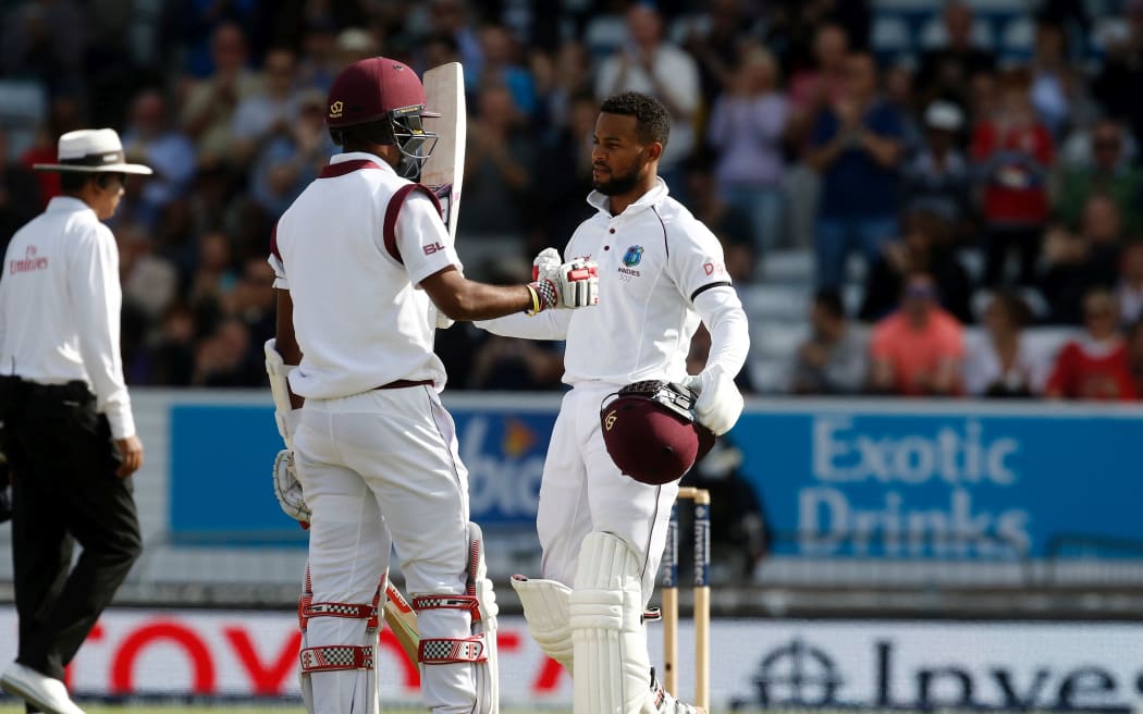 West Indies batsman Shai Hope is congratulated by batting partner Kraigg Brathwaite