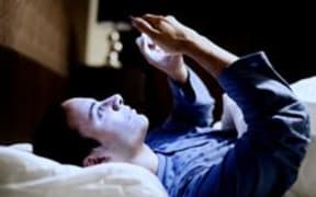 smartphone in bed