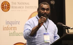 Ishmael Toroama speaking at PNG think-tank, The National Research Institute.